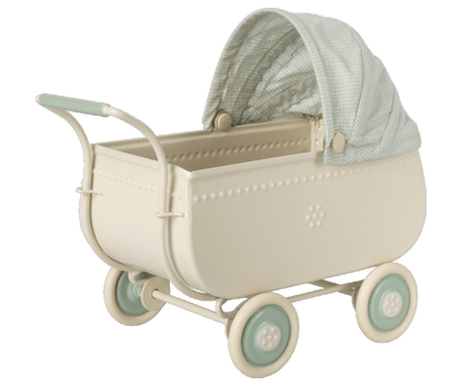 A Maileg Micro Pram with a pink striped blanket.