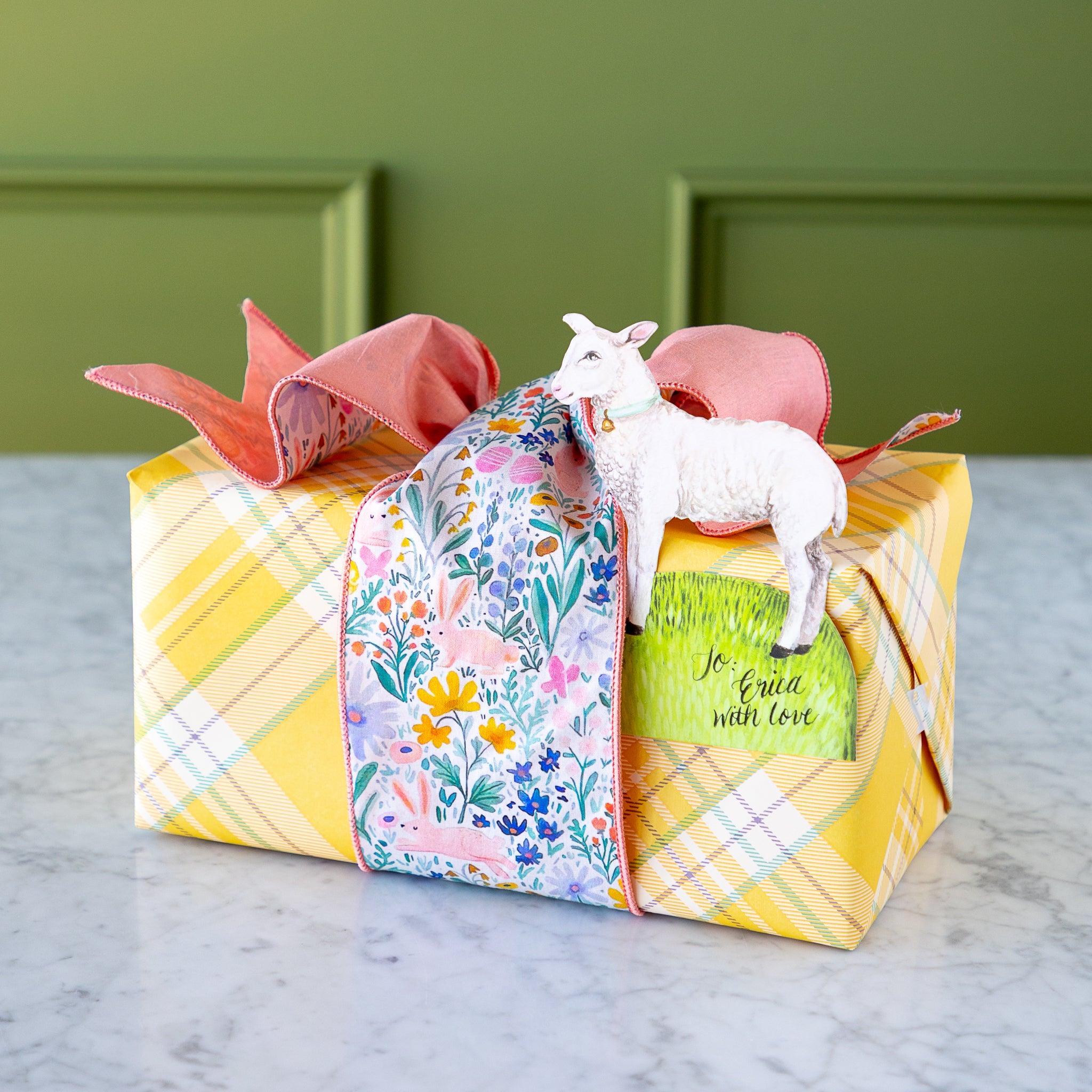 Poplin Watercolor Floral Bunny Ribbon tied around a wrapped gift.