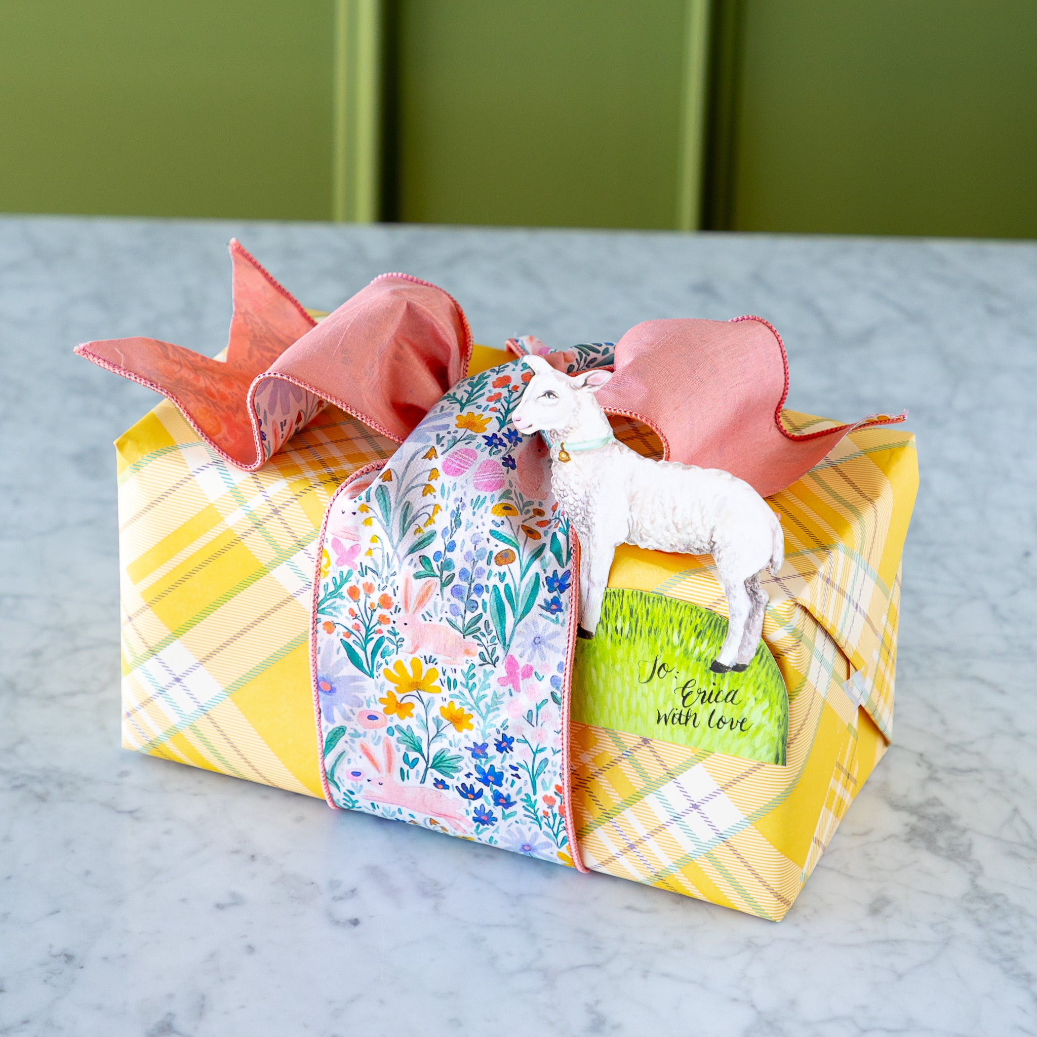 Poplin Watercolor Floral Bunny Ribbon tied around a wrapped gift.