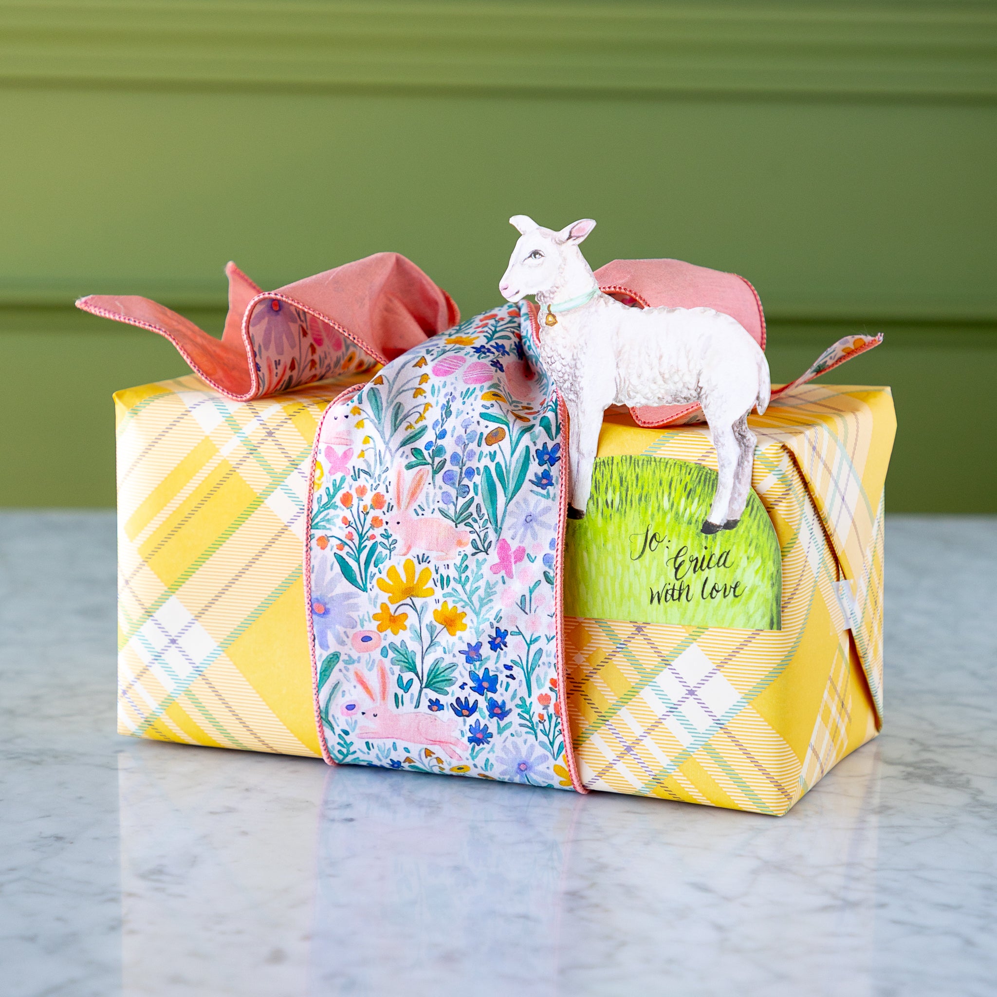 Poplin Watercolor Floral Bunny Ribbon tied around a wrapped gift.