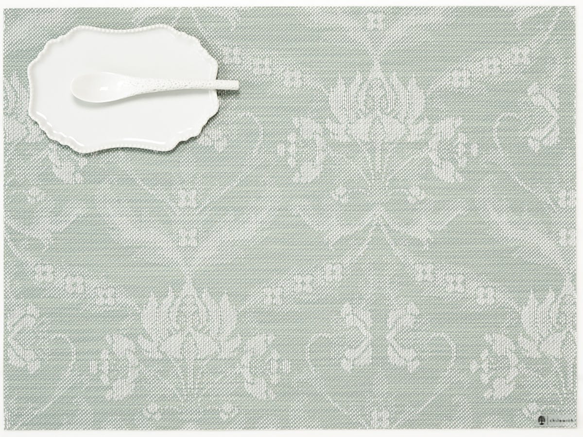 Abolene Damask Rectangle Placemat with small plate and spoon on it.