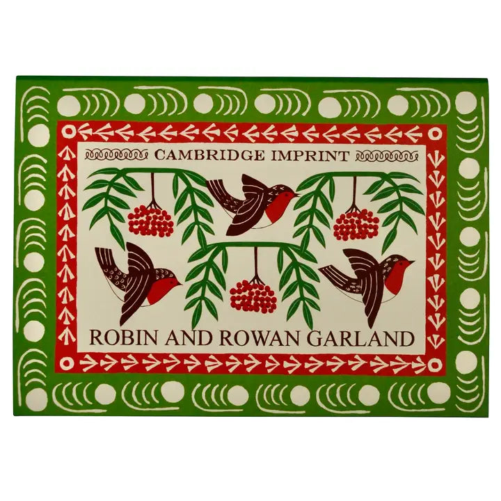 The red, green and cream Robin and Rowan Garland packaging on a white background.