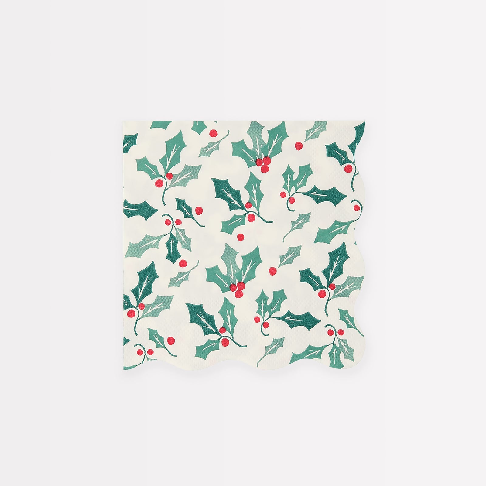 Meri Meri Holly Pattern Small Napkins in a scalloped shape, with a holly design, are the perfect party napkins to add to your Christmas party supplies.