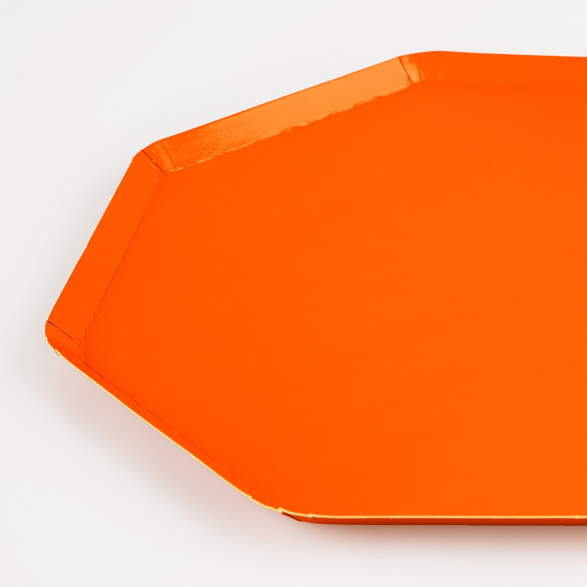 Orange paper plate on a white background