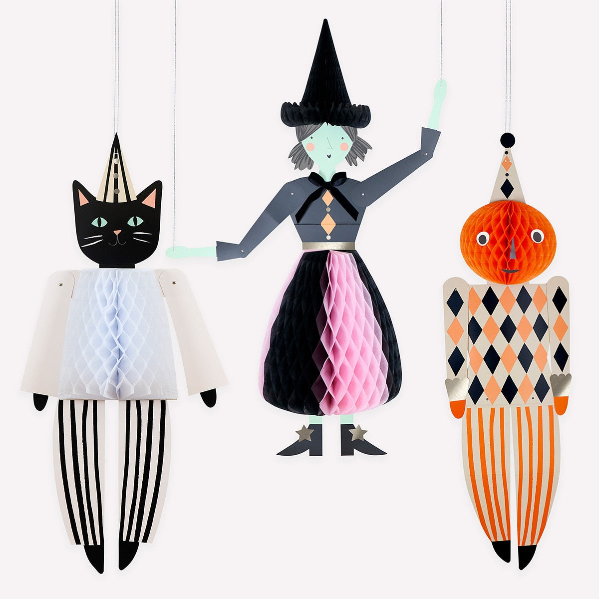Halloween-themed honeycomb decor including a cat, witch, and pumpkin on a white background.