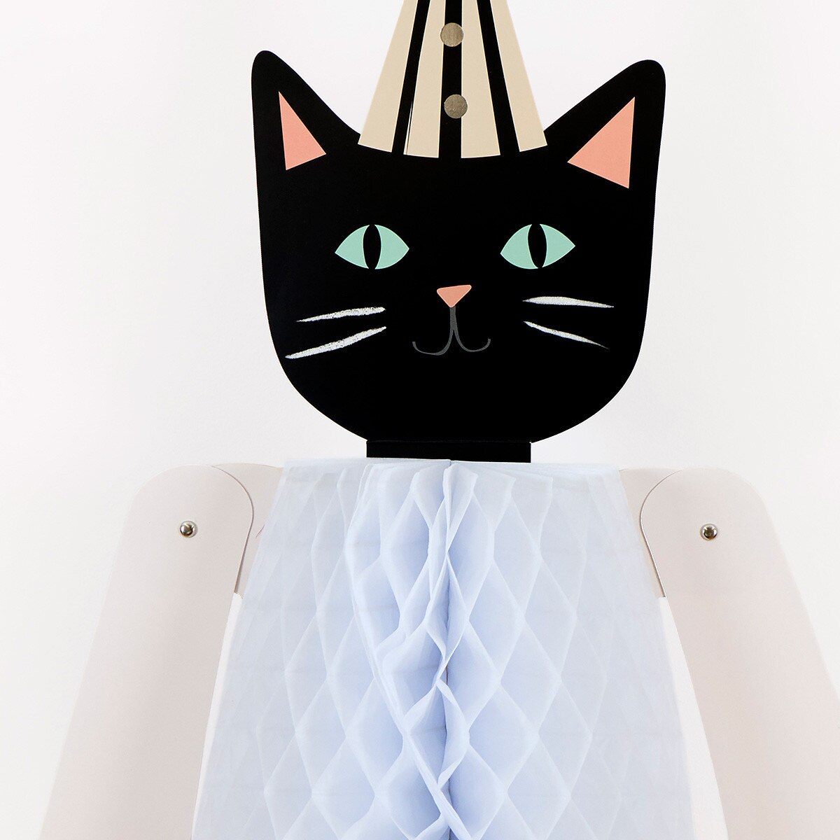 Black cat-shaped Halloween decor on a white background.