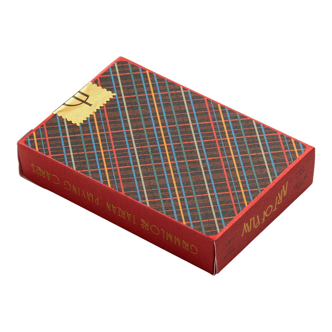 Plaid-patterned playing card box with visible text on a white background