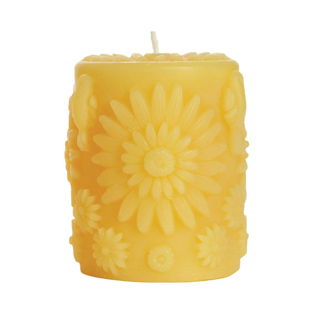 A yellow beeswax pillar candle covered with large and small 3D circular flowers, including a flower on the top surface.