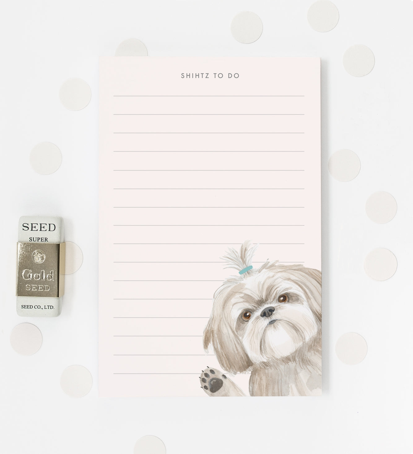 A lined notepad with an illustration of a shih tzu dog in the corner waving. At the top of the notepad is printed "Shihtz to do".