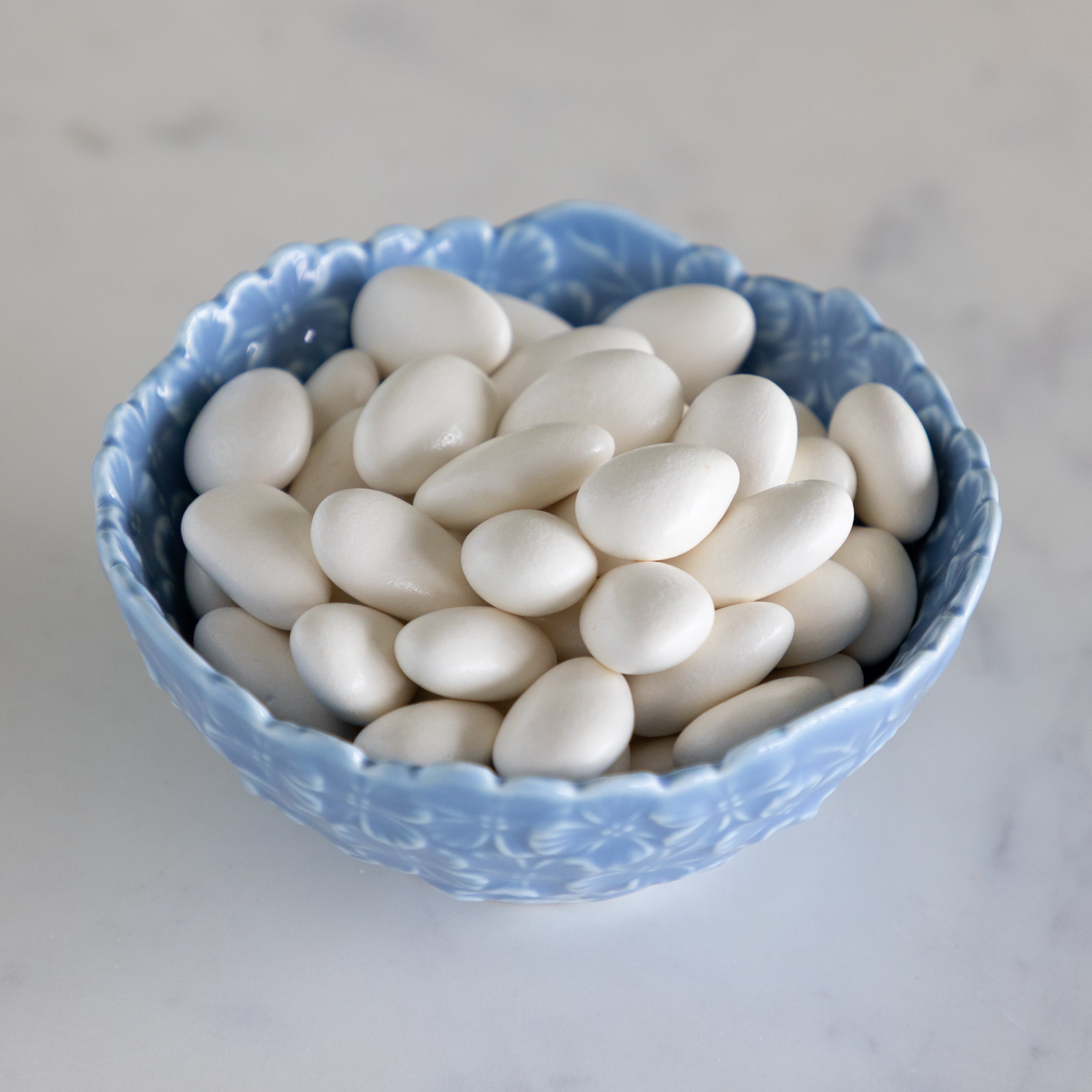 Hydrangea Tidbit Bowl filled with white chocolate covered almonds.