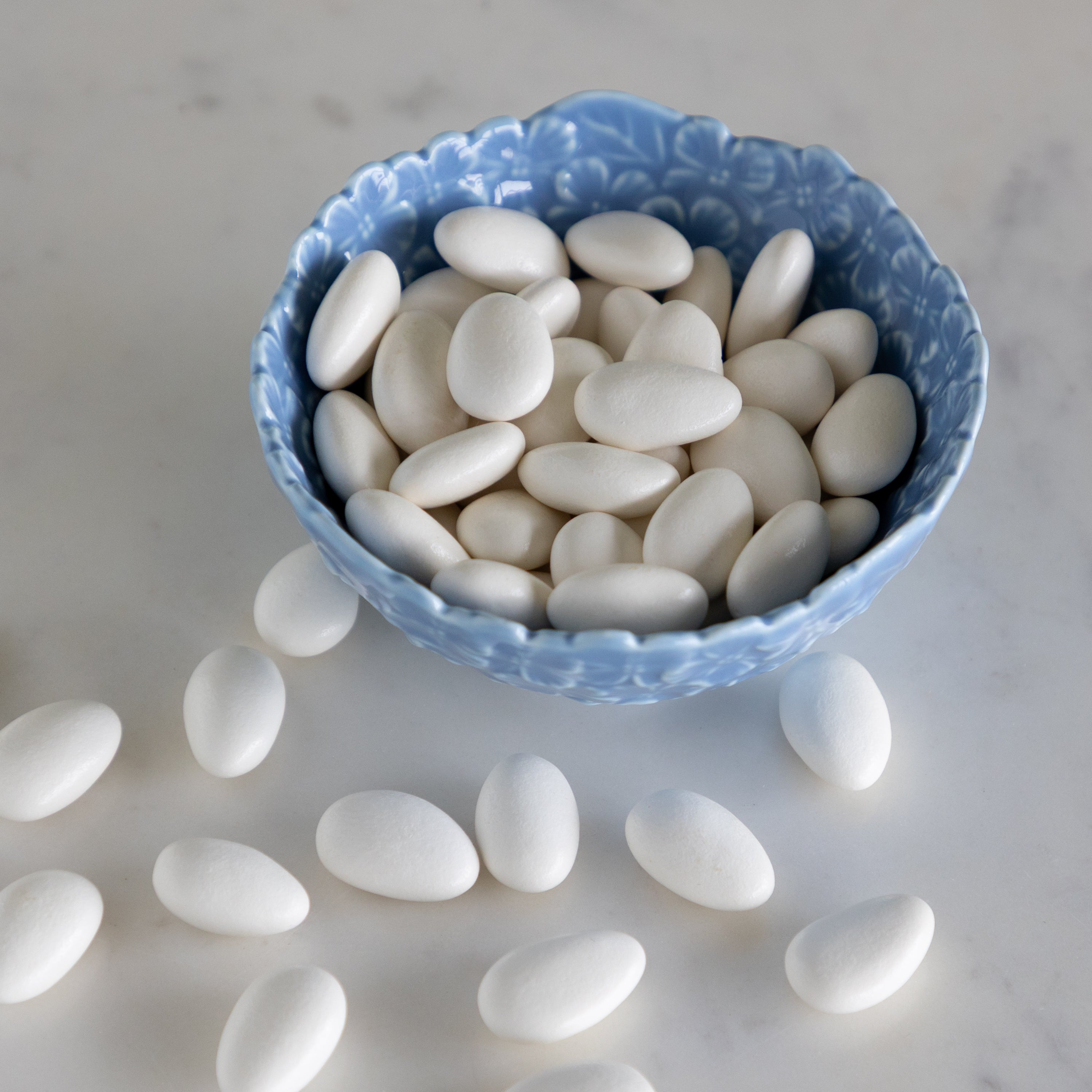Hydrangea Tidbit Bowl filled with white chocolate covered almonds.