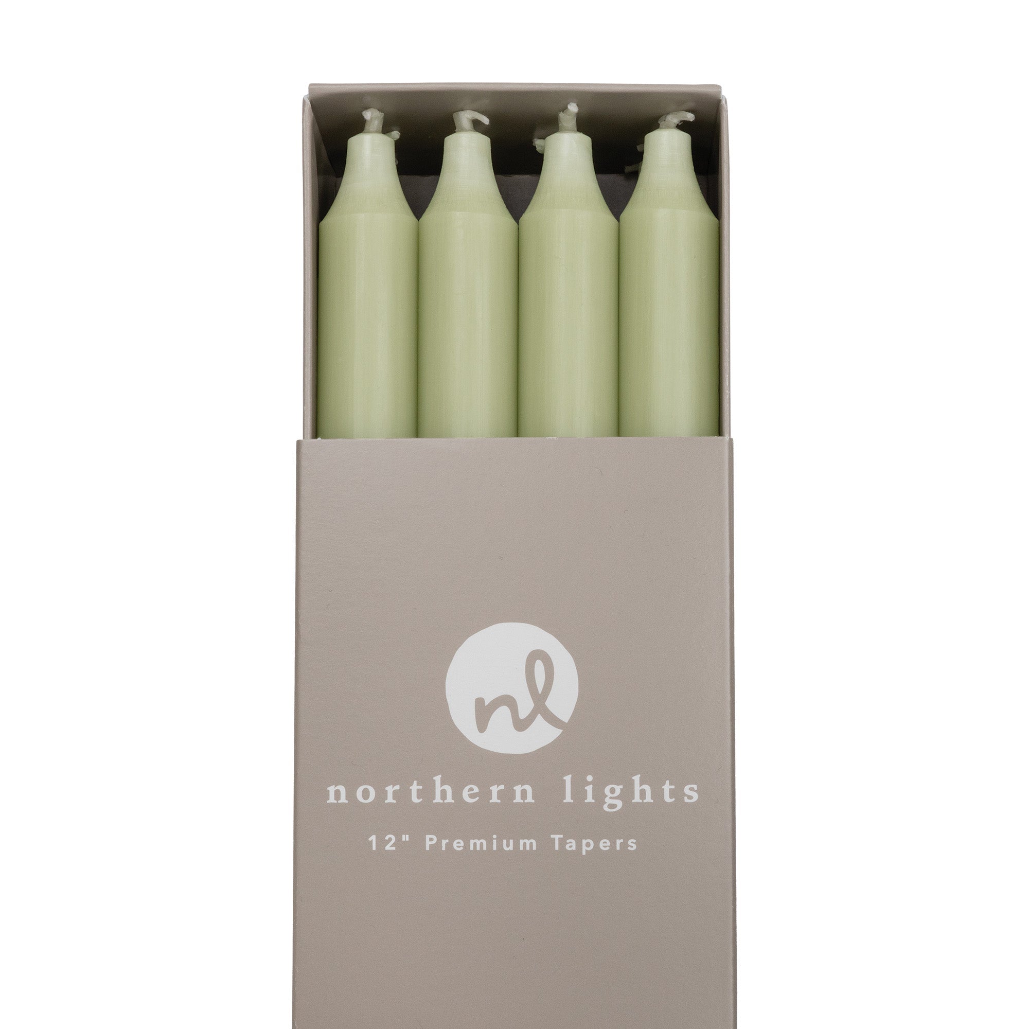 A box of sage green 12 inch taper candles made by Northern Lights.