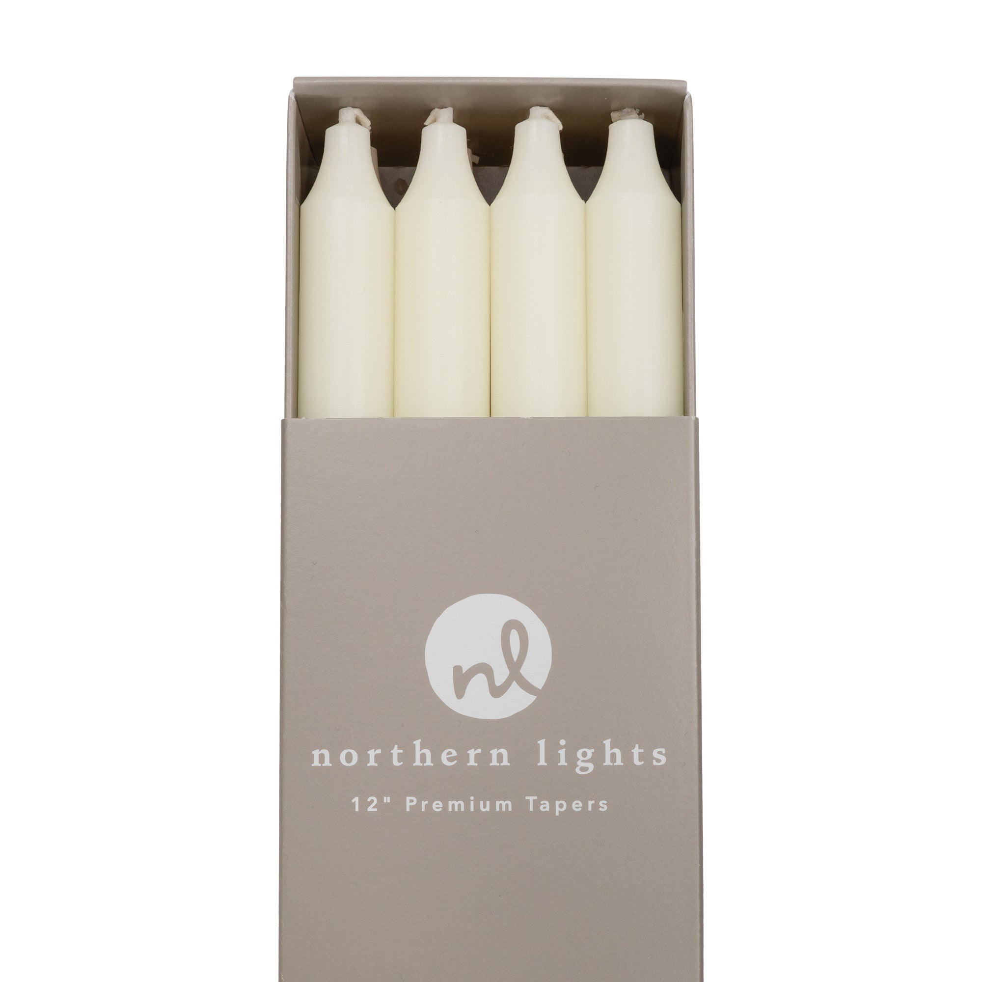 A box of ivory taper candles by Northern Lights.