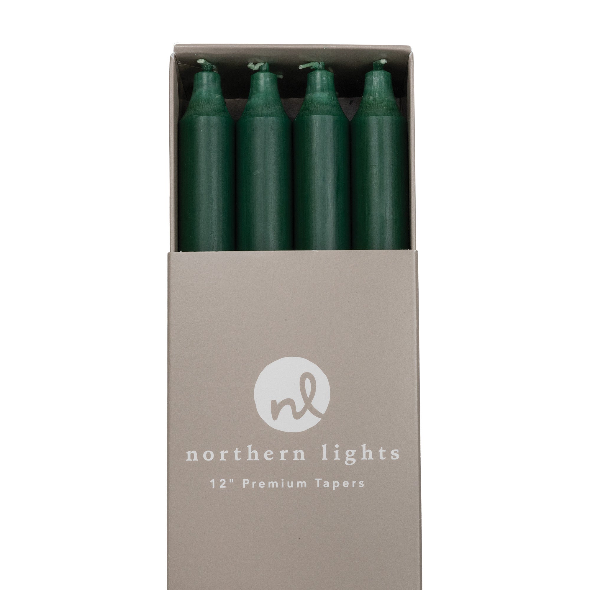 A box of dark green taper candles by Northern Lights.