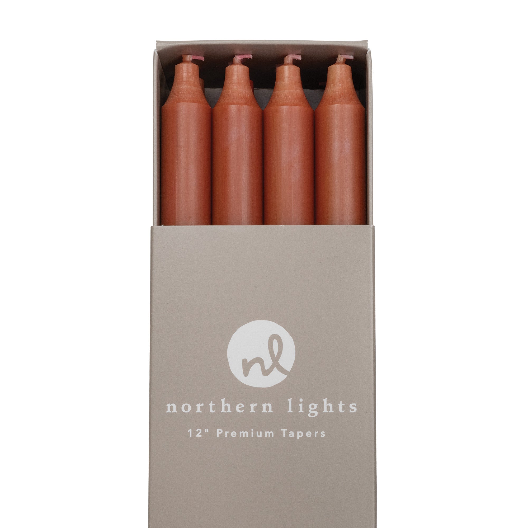 A box of terracotta colored taper candles by Northern Lights.