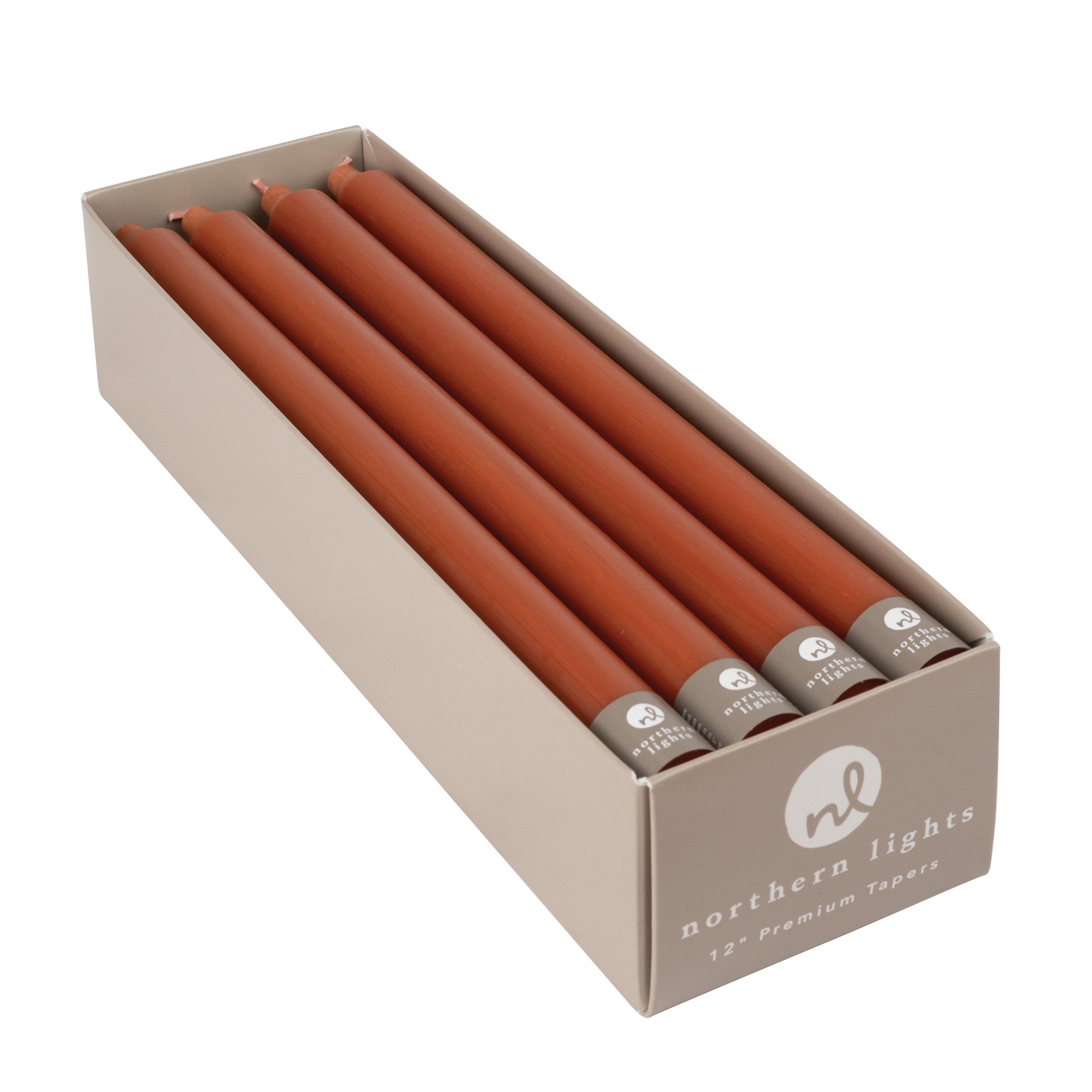 A box of terracotta colored taper candles by Northern Lights.
