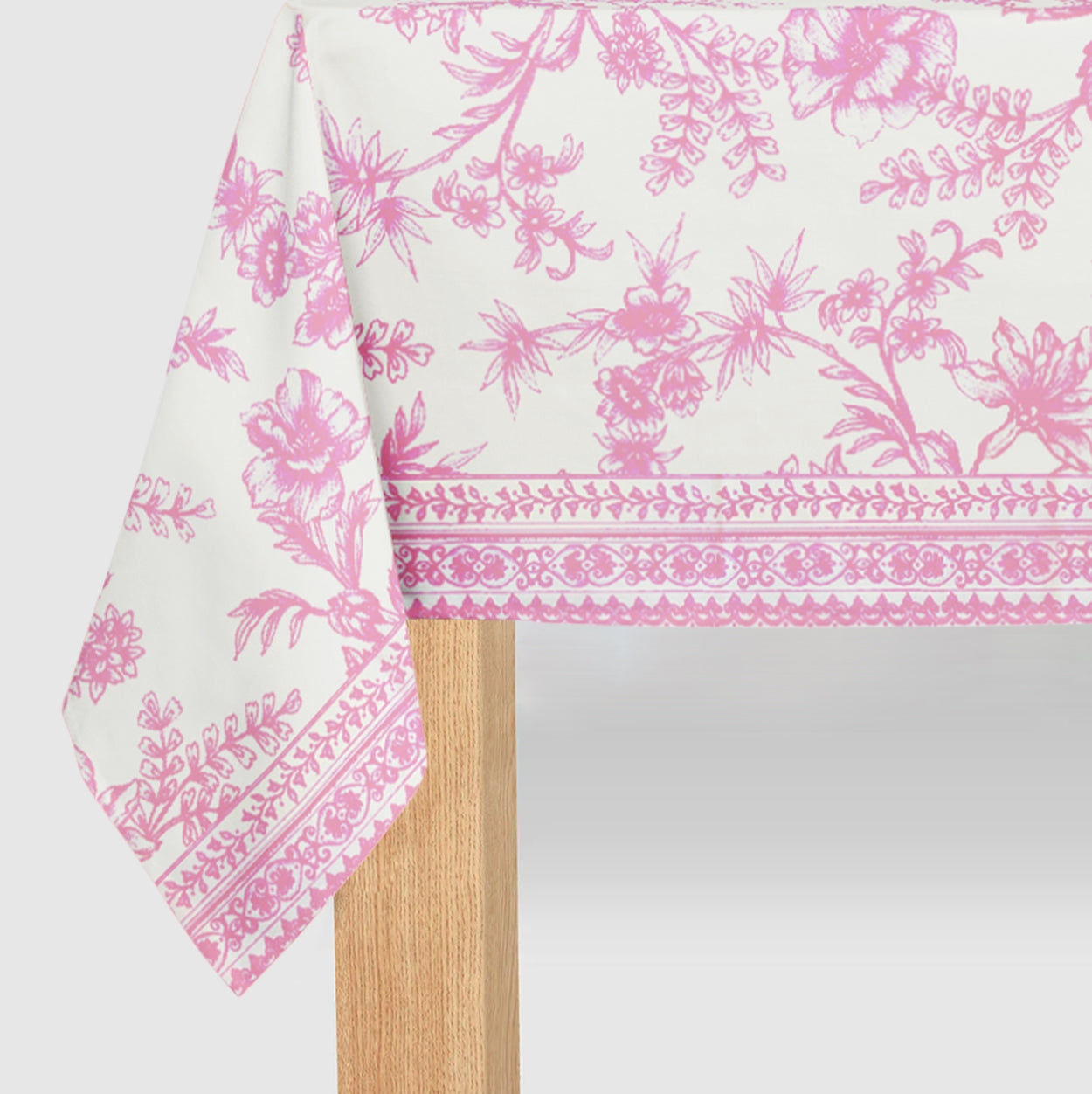 Pink French Toile Paper Tablecloth on a table.