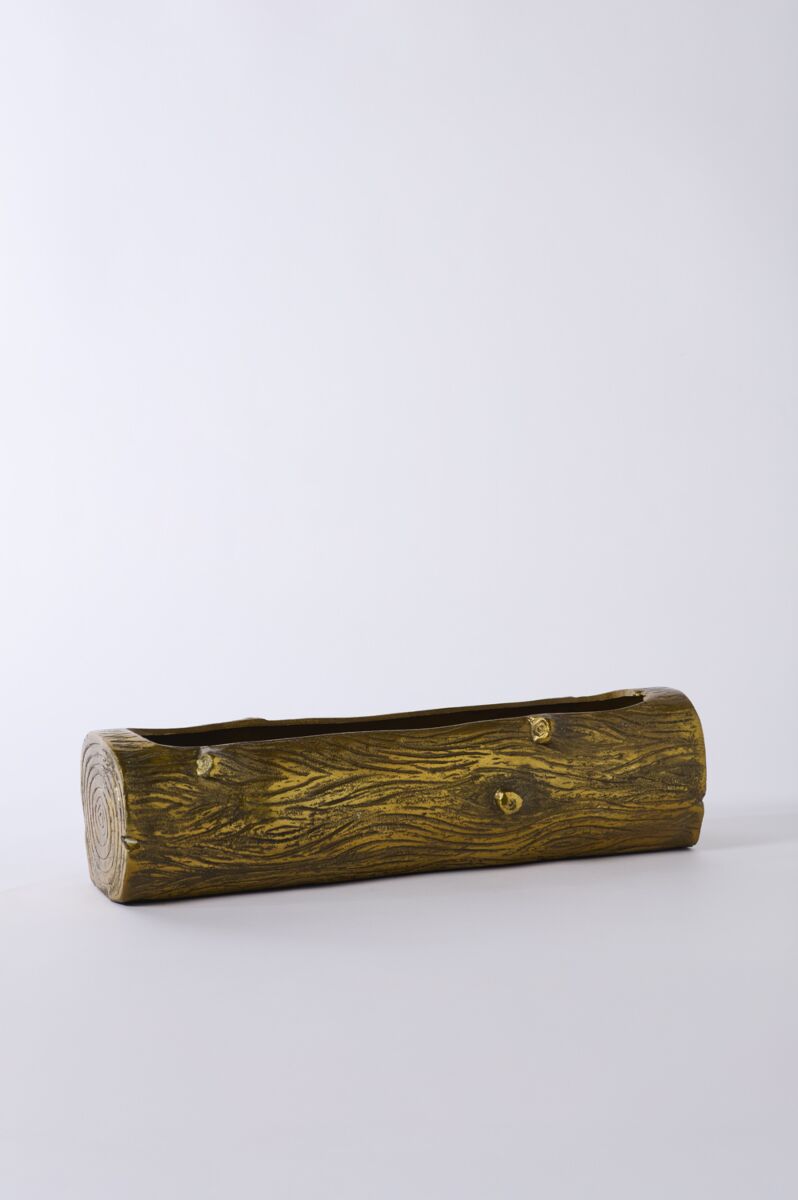 Wooden log-shaped planter on a white background.