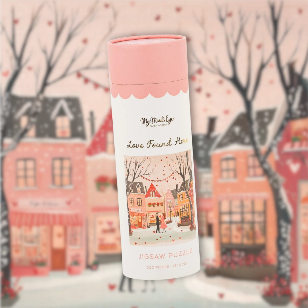 Jigsaw puzzle box with a winter scene design on a snowy village background.