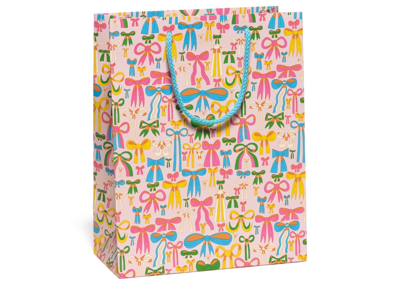 Gift bag with illustrations of lots of bows in multiple colors and styles all over it with a pink background and a bright blue handle.
