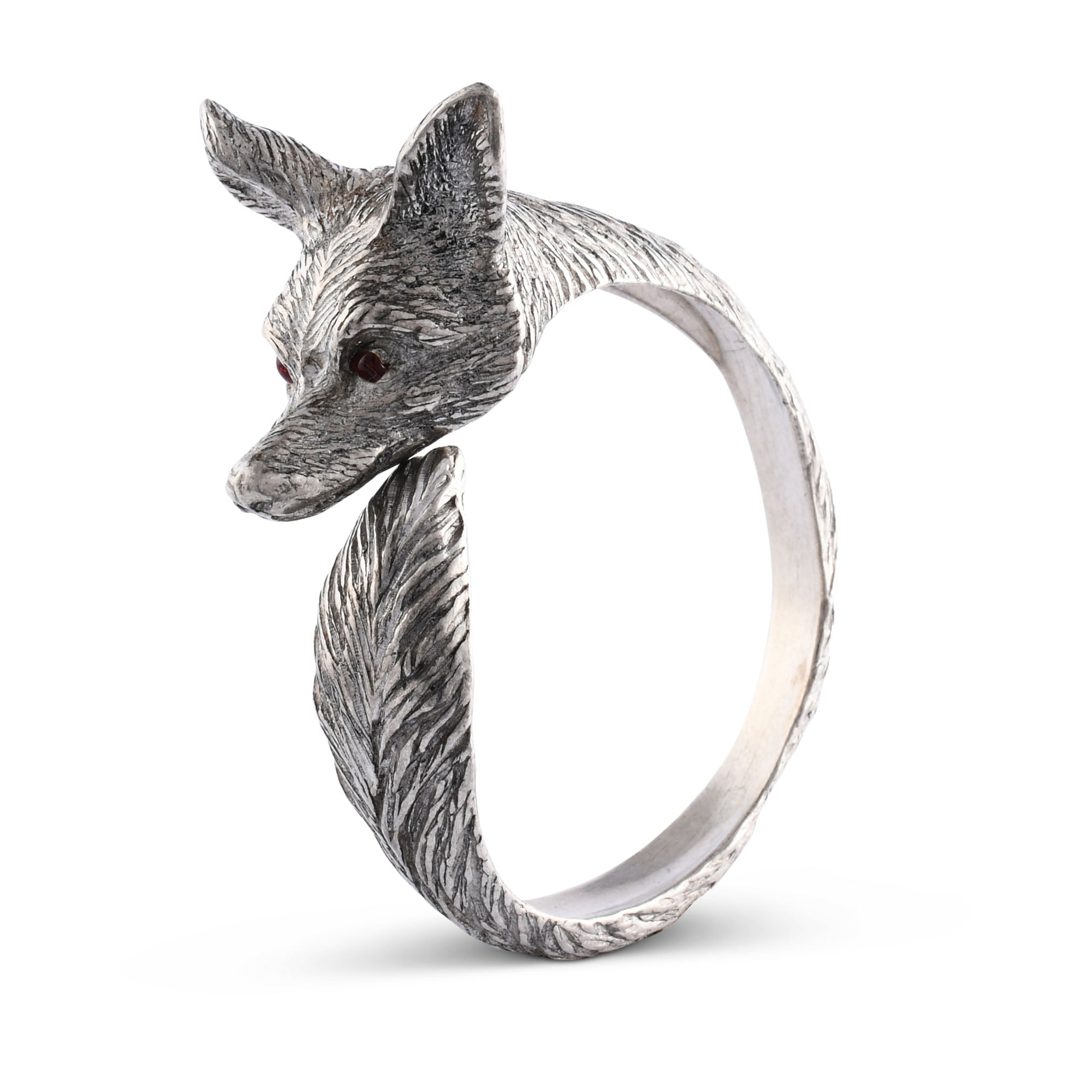 Silver napkin ring with a fox design and red eyes on a white background.