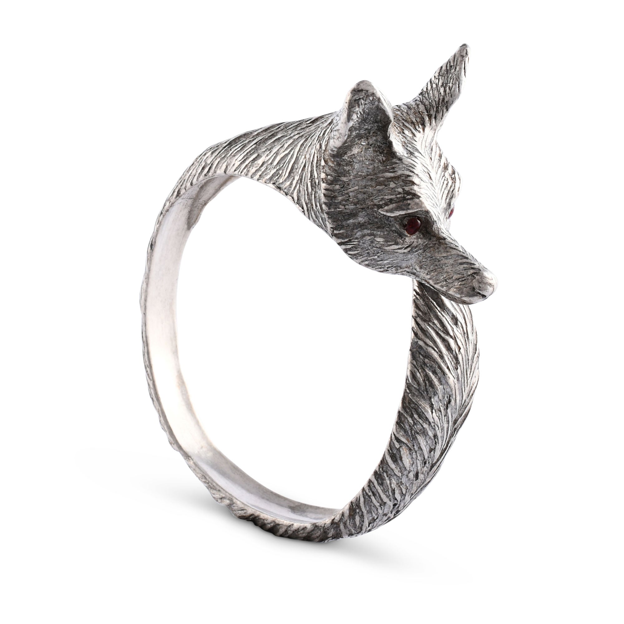 Silver napkin ring with a fox head design on a white background.