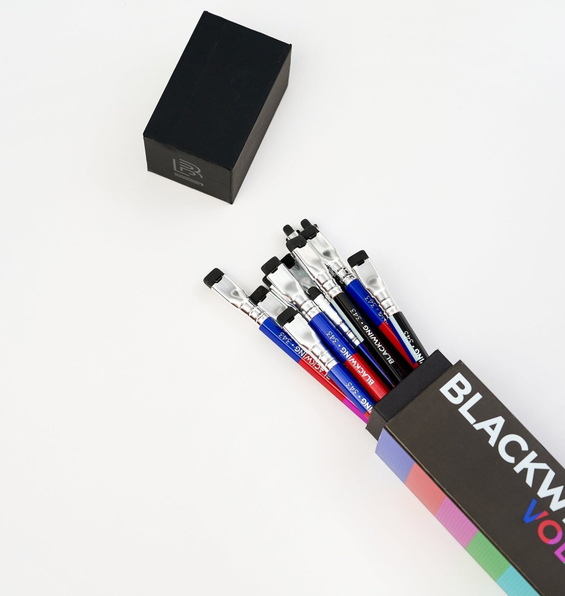 Blackwing Volumes 343 pencils coming out of the top of their packaging.