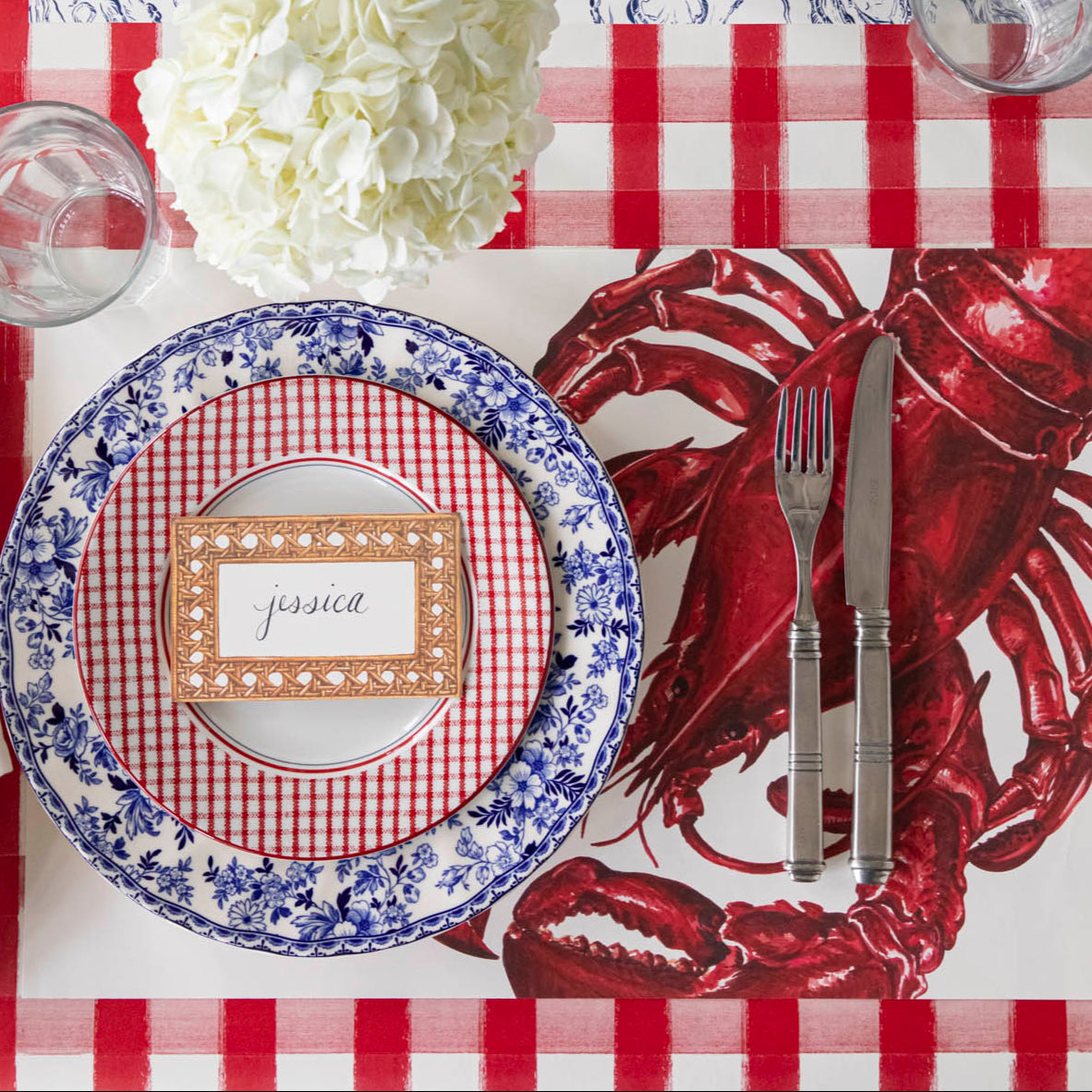 Rattan Weave Place Card with "Jessica" written on it, on a nautical themed table setting.