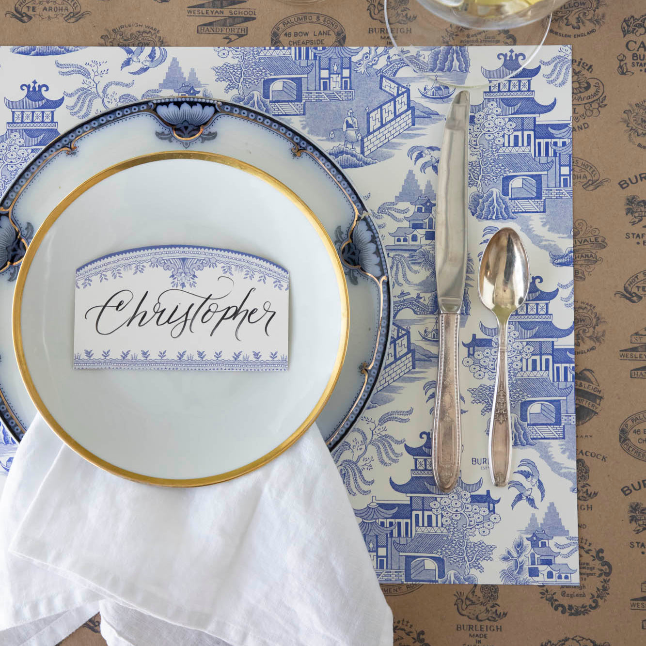 Blue Willow Classic Placemat with the Kraft Burleigh Heritage Runner underneath, styled elegantly with a place setting for one.