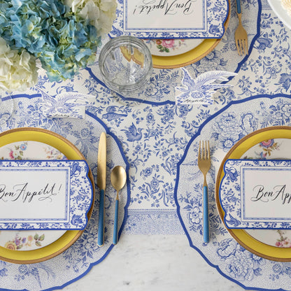 The Die-cut Blue Asiatic Pheasants Placemat in an elegant table setting, from above.