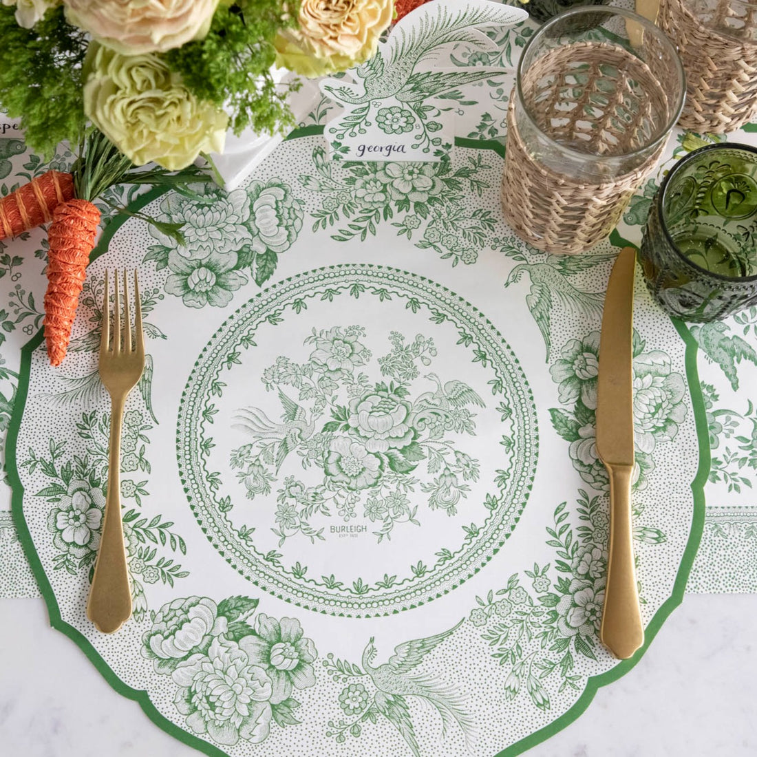 The Die-cut Green Asiatic Pheasants Placemat in an elegant place setting sans plate, from above.