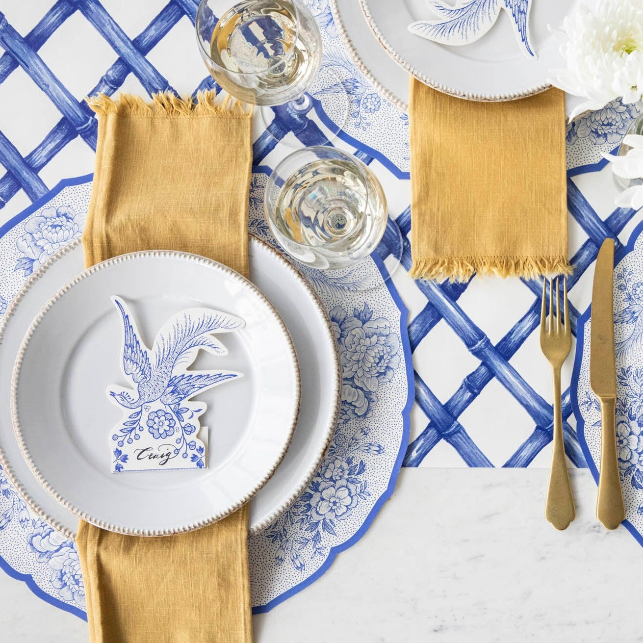 The Die-cut Blue Asiatic Pheasants Placemat in an elegant table setting, from above.