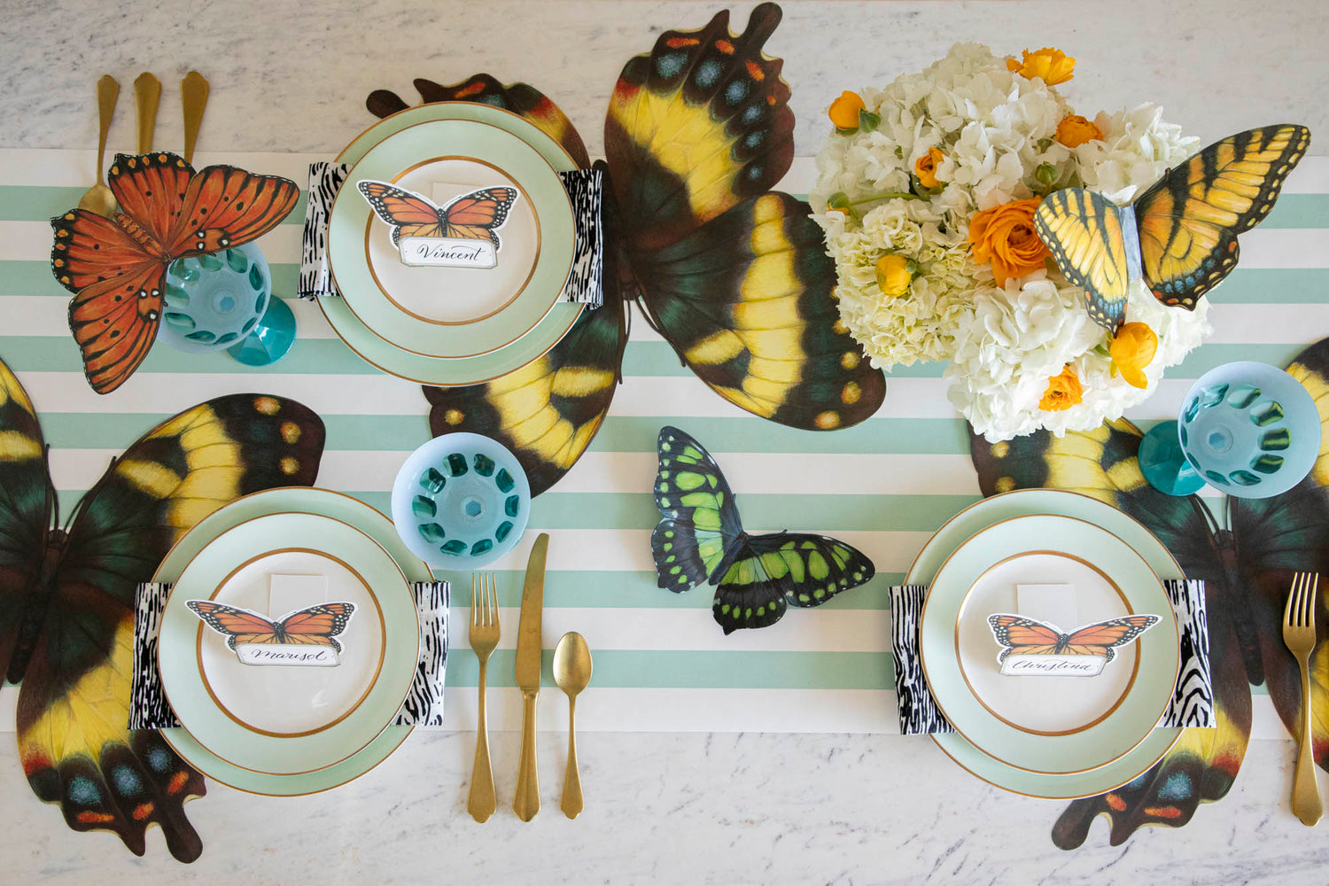 Overhead view of an elegant butterfly-themed tablescape featuring Die-cut Butterfly Placemats.