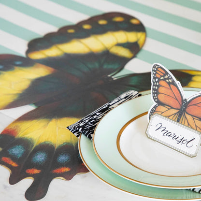 Close-up of a butterfly-themed place setting on a Die-cut Butterfly Placemat.