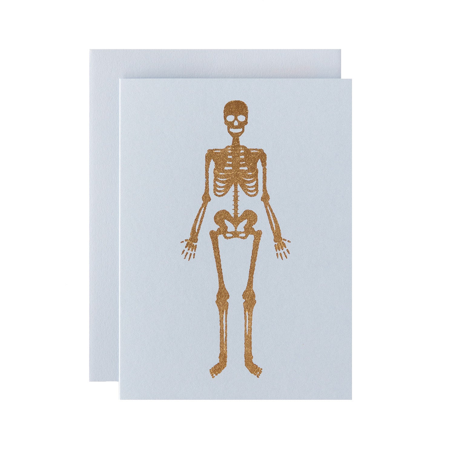 A gold foiled human skeleton on a light grey background, with a matching envelope.