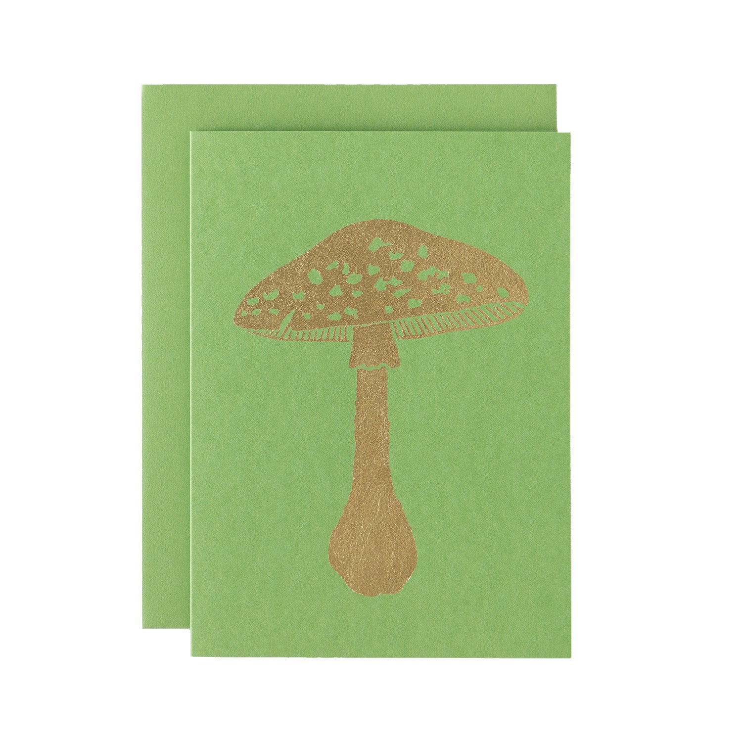 A gold leafed mushroom on a grass green card with a matching envelope.