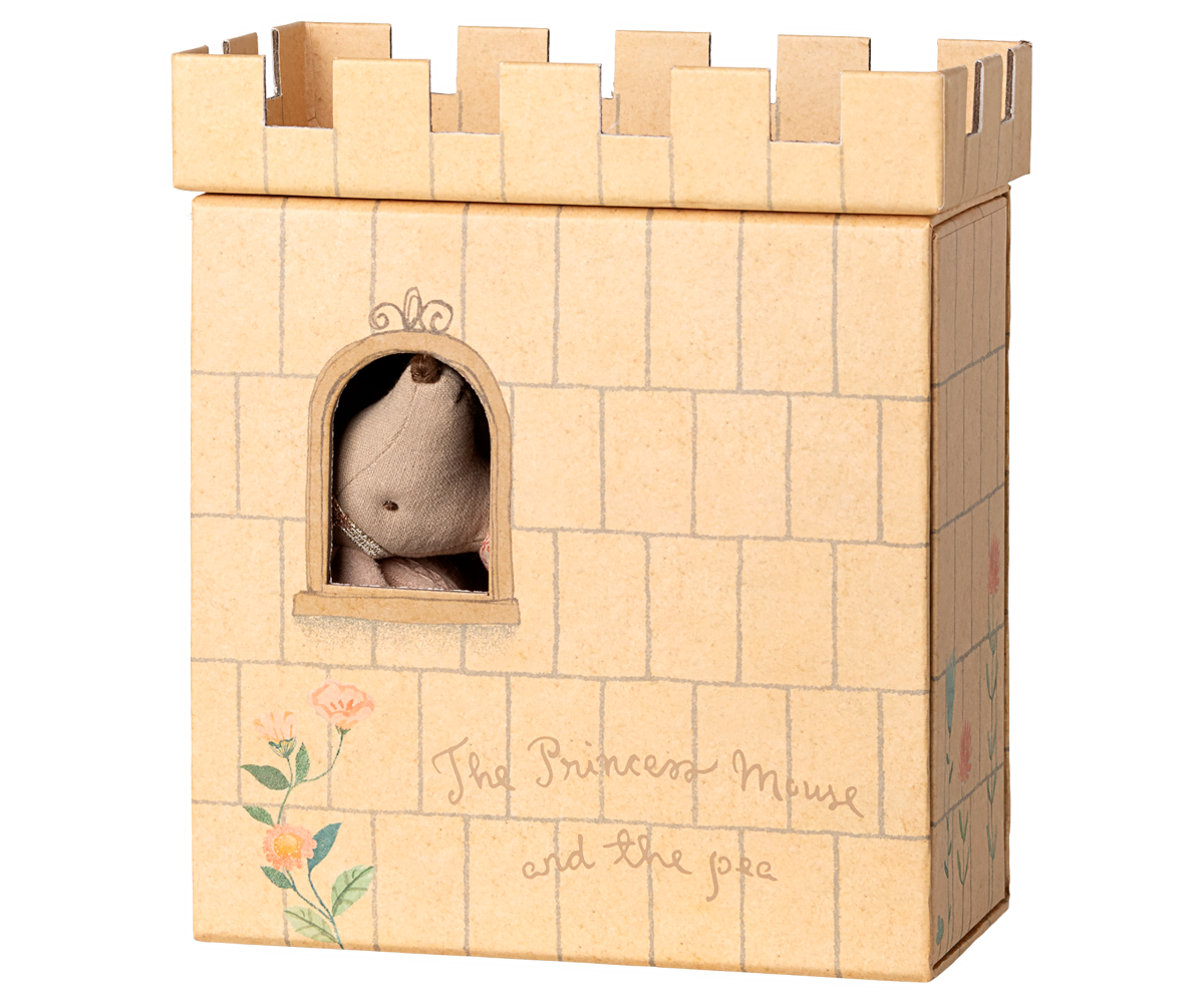 Castle toy with a small plush toy inside, on a white background.