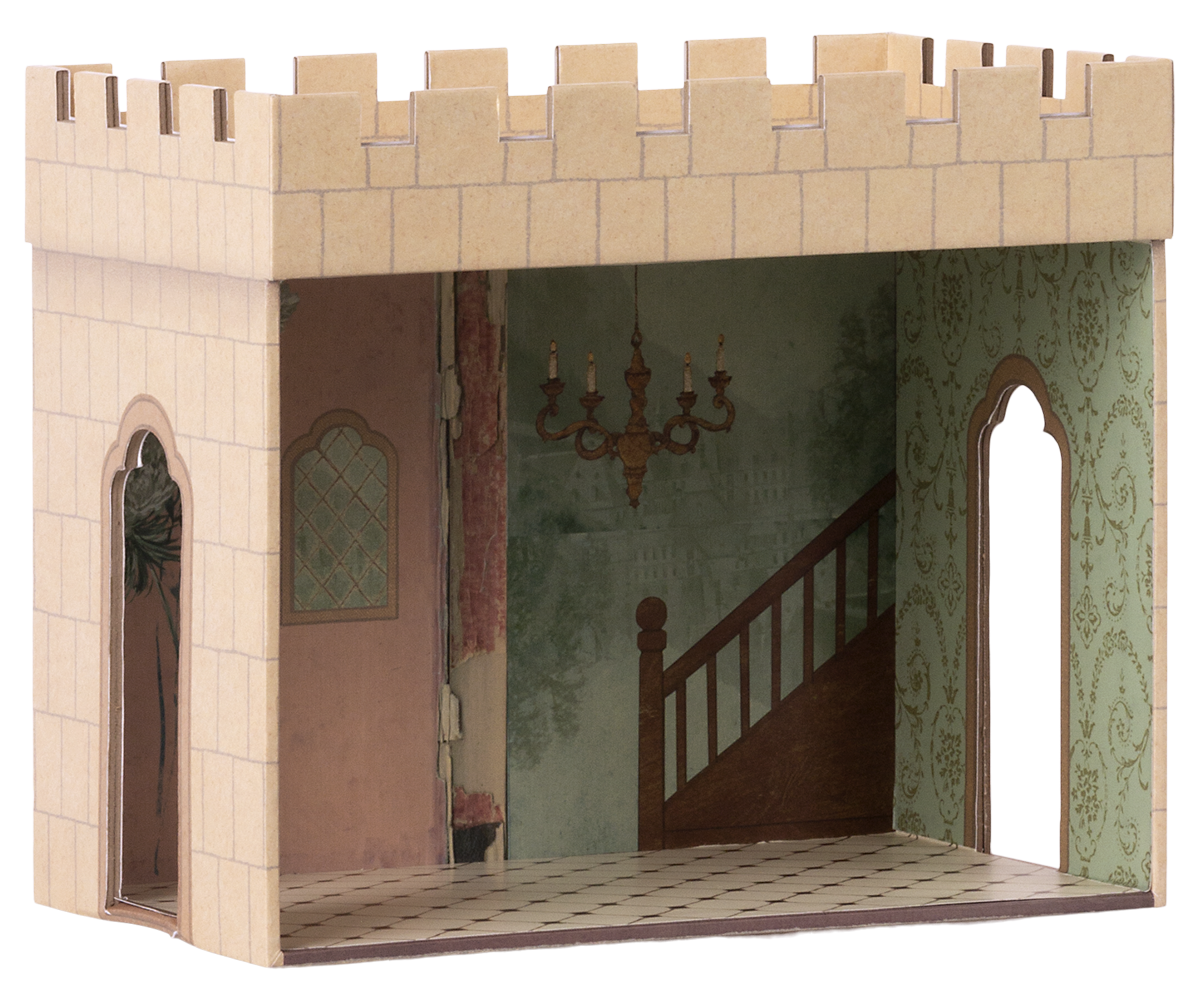Cardboard castle model with interior details on a white background.