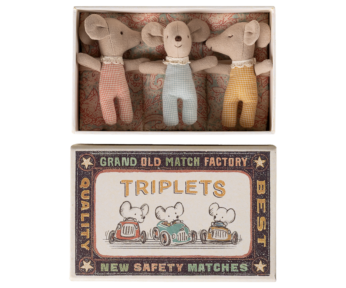 Three toy mice in a matchbox with a vintage-style label.