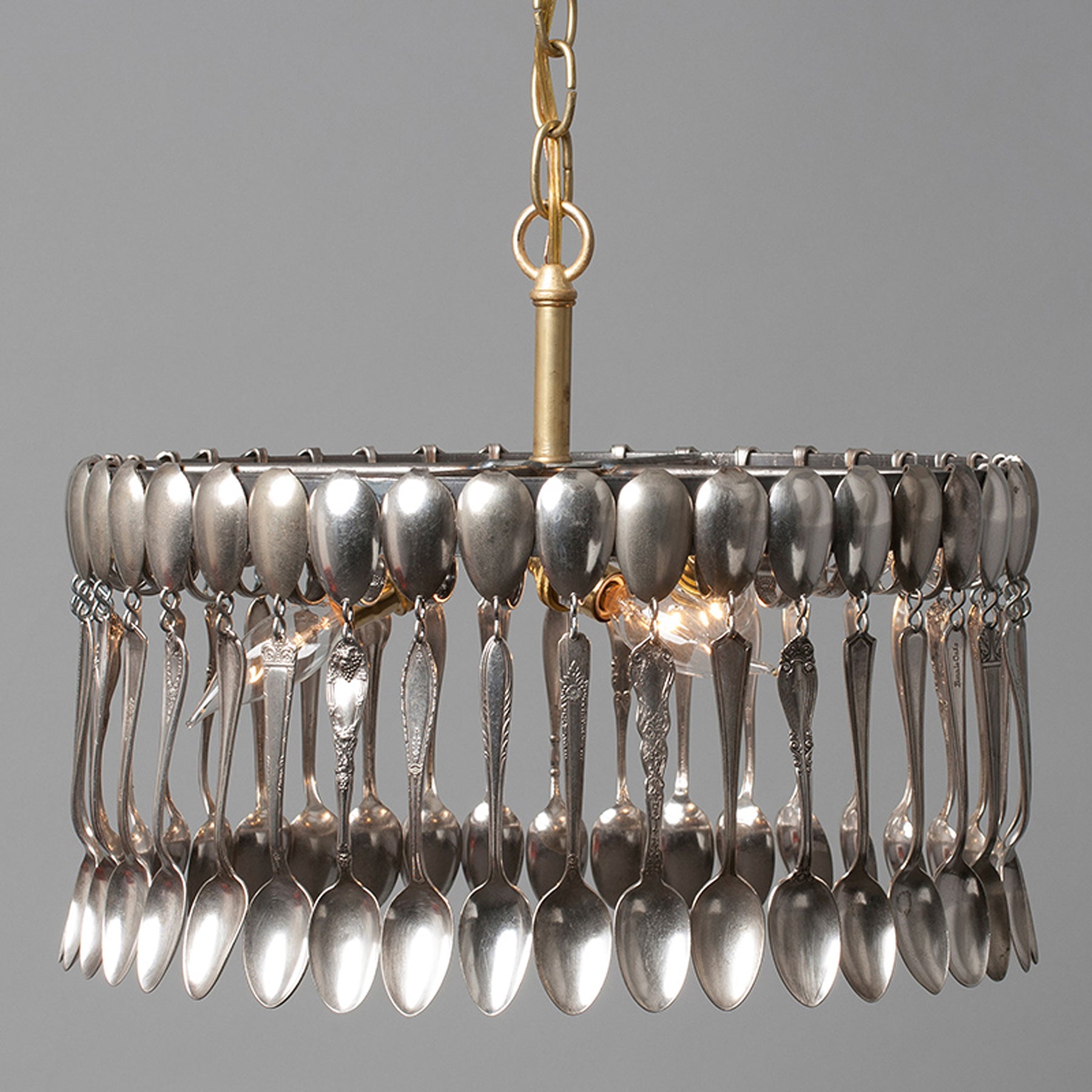 A hand-crafted Spoon Pendant Light made of vintage spoons hanging from a chain by Hester & Cook.