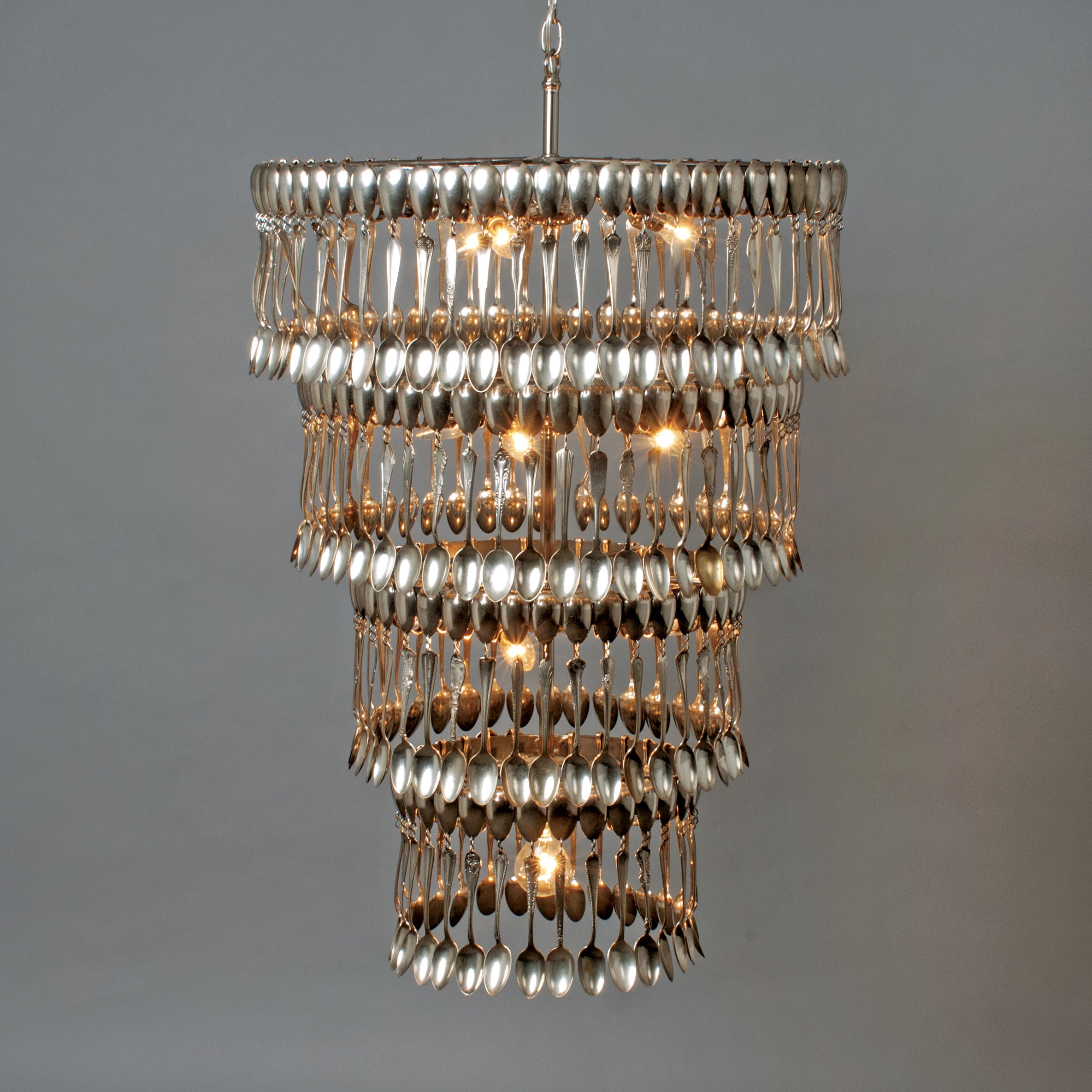 A vintage Quad Tier Spoondelier made out of silver spoons by Hester & Cook.