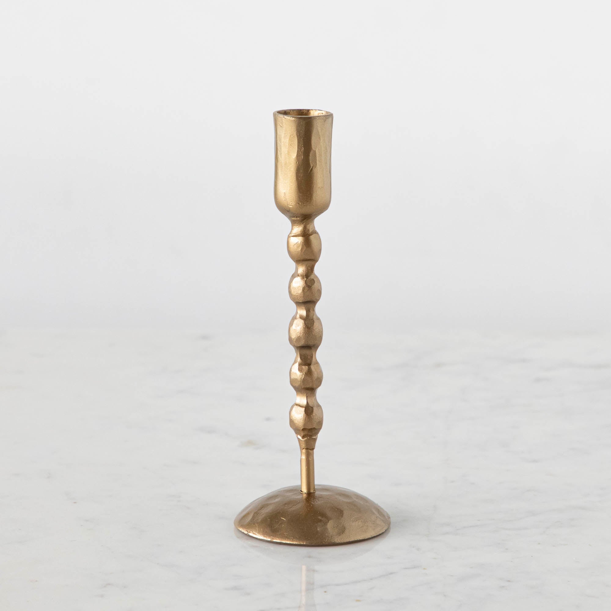 Tall gold twisted candle holder.