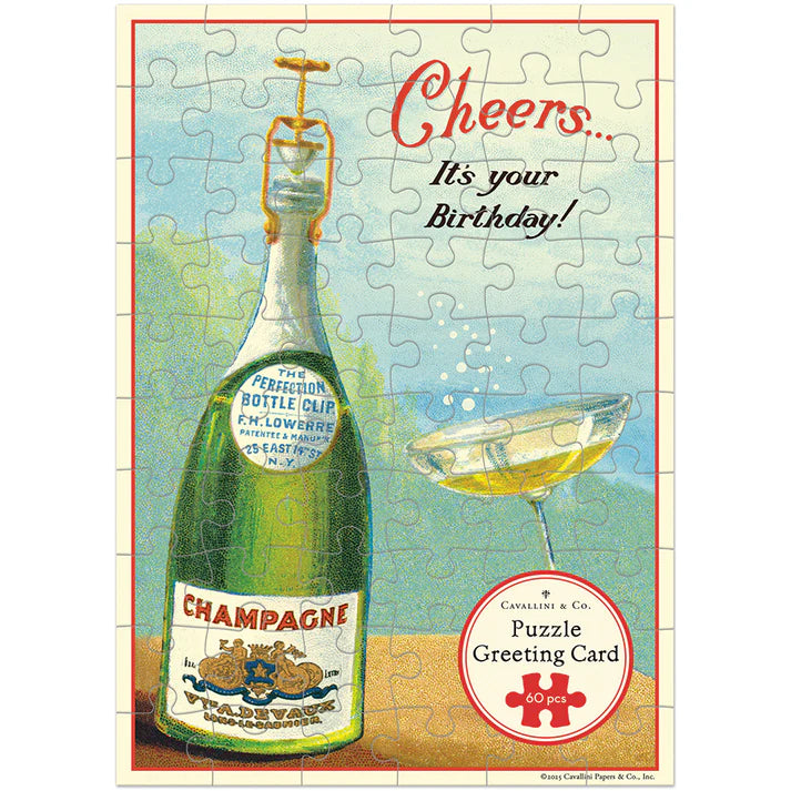 Vintage-style puzzle greeting card with champagne bottle and glass, featuring text &