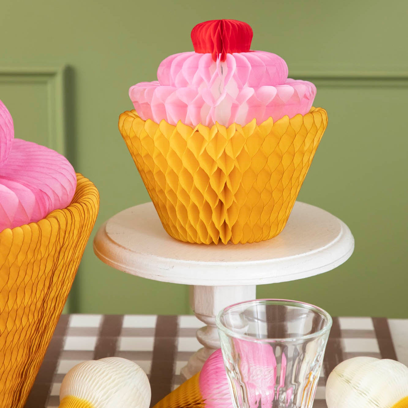 Medium Honeycomb Cupcake on a pedestal next to the Large Honeycomb Cupcake.