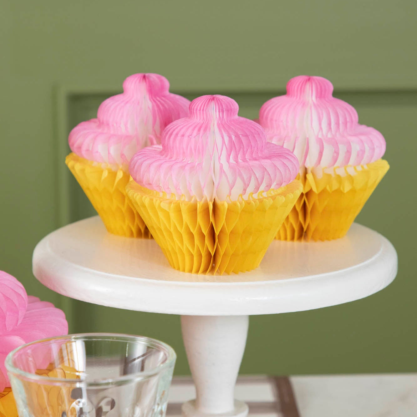 Honeycomb Small Cupcake Set of 3 on a cake pedestal, on a table.
