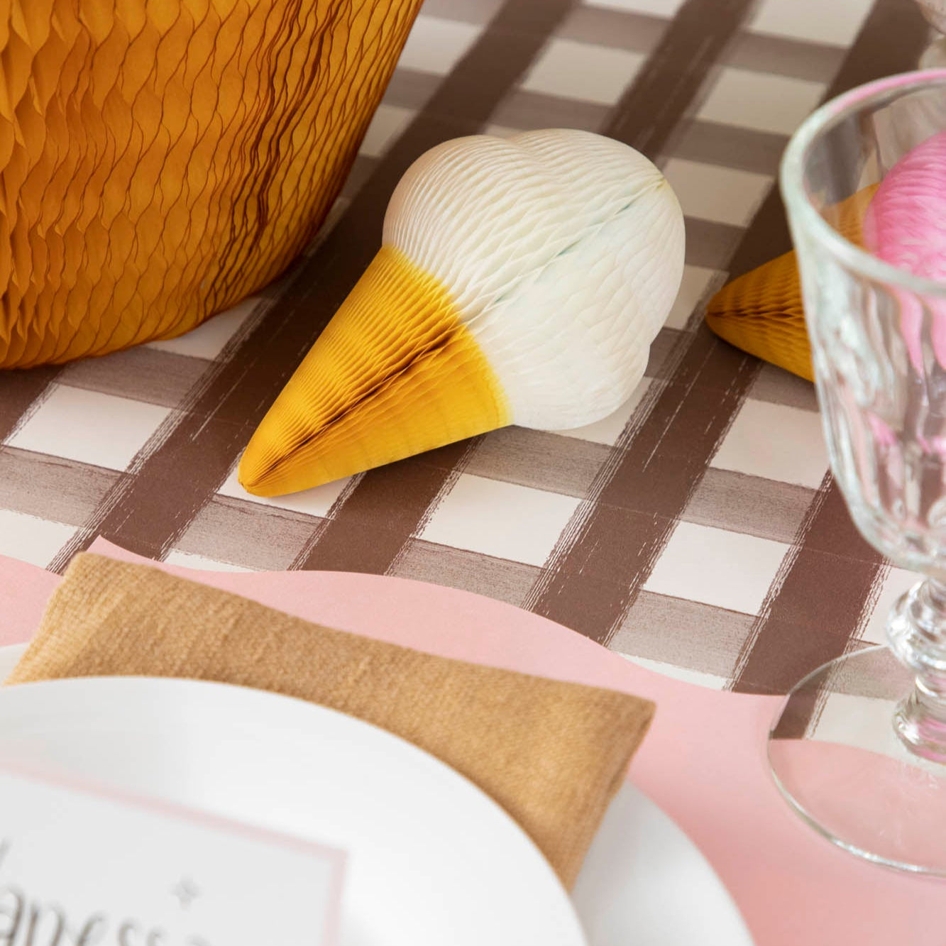 Honeycomb Small Ice Cream Cone in vanilla, behind a place setting for one.
