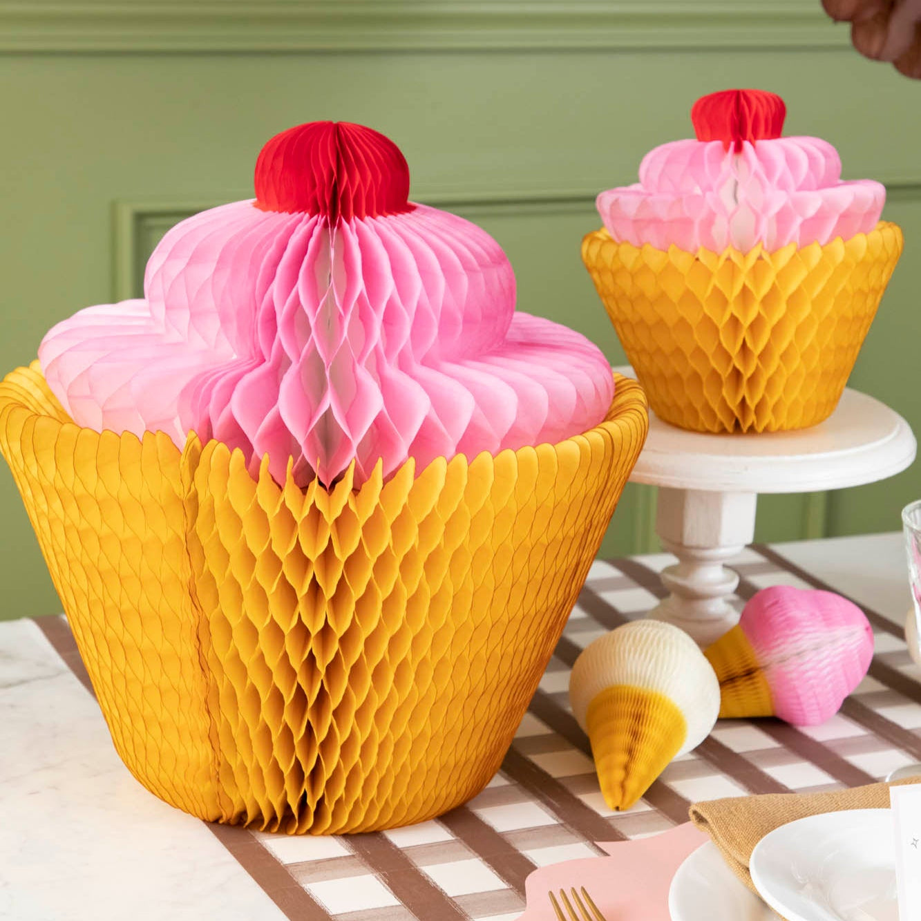 Medium and Large Honeycomb Cupcake styled on a table.