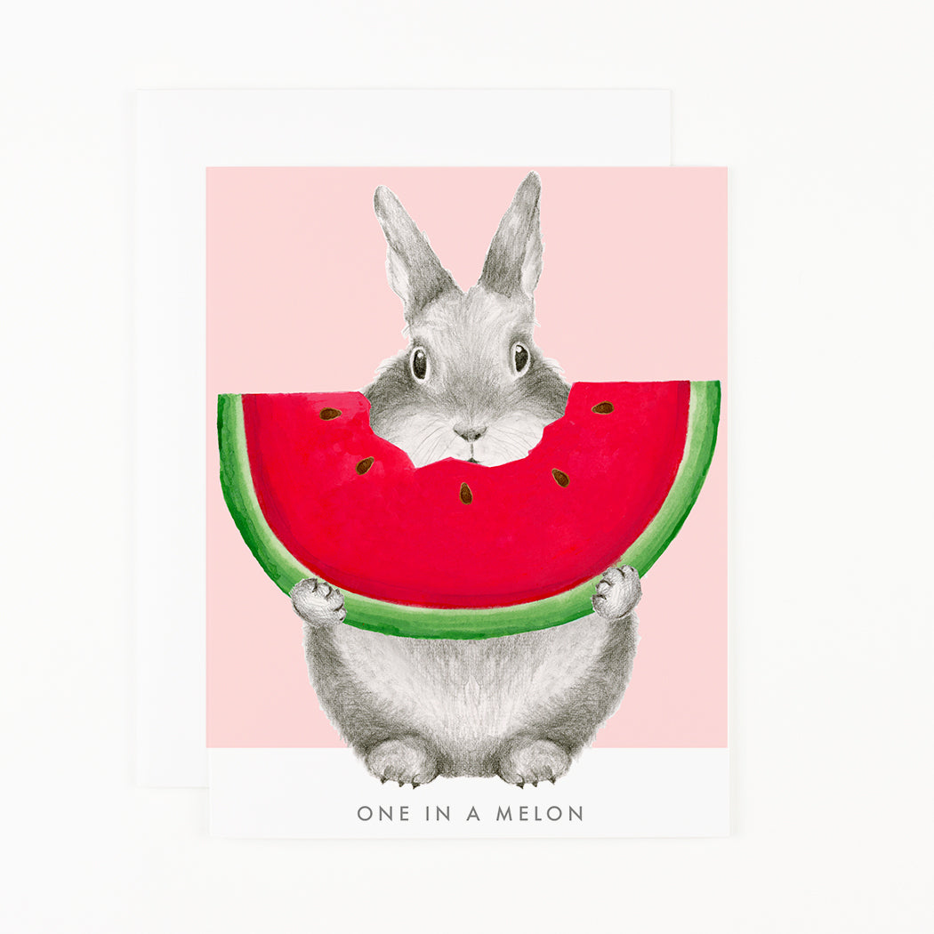 A whimsical hand-painted illustration of a bunny holding a slice of watermelon with the words &quot;One in a Melon Boxed Set of 6&quot; below it, from Dear Hancock.