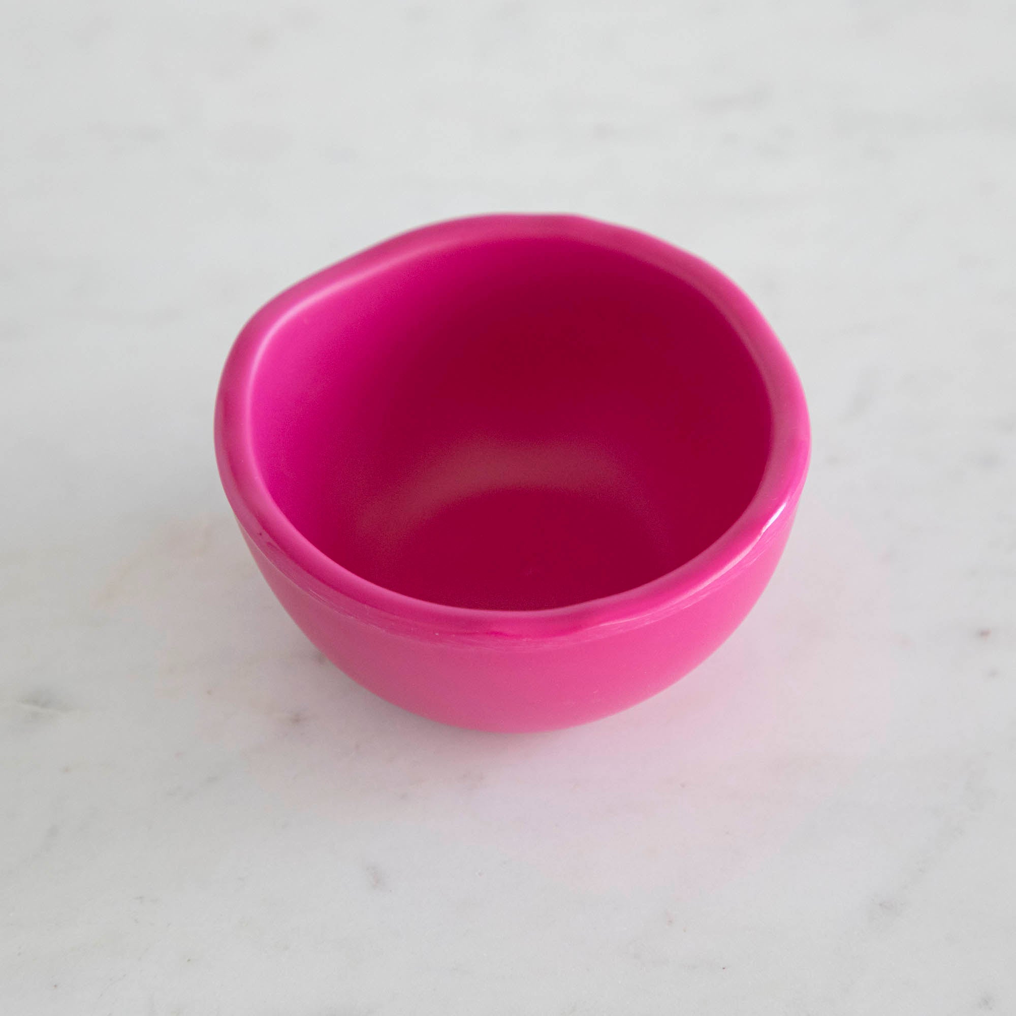 A set of colorful, dishwasher-safe Glitterville Rainbow Melamine Trinket Bowls on a table.