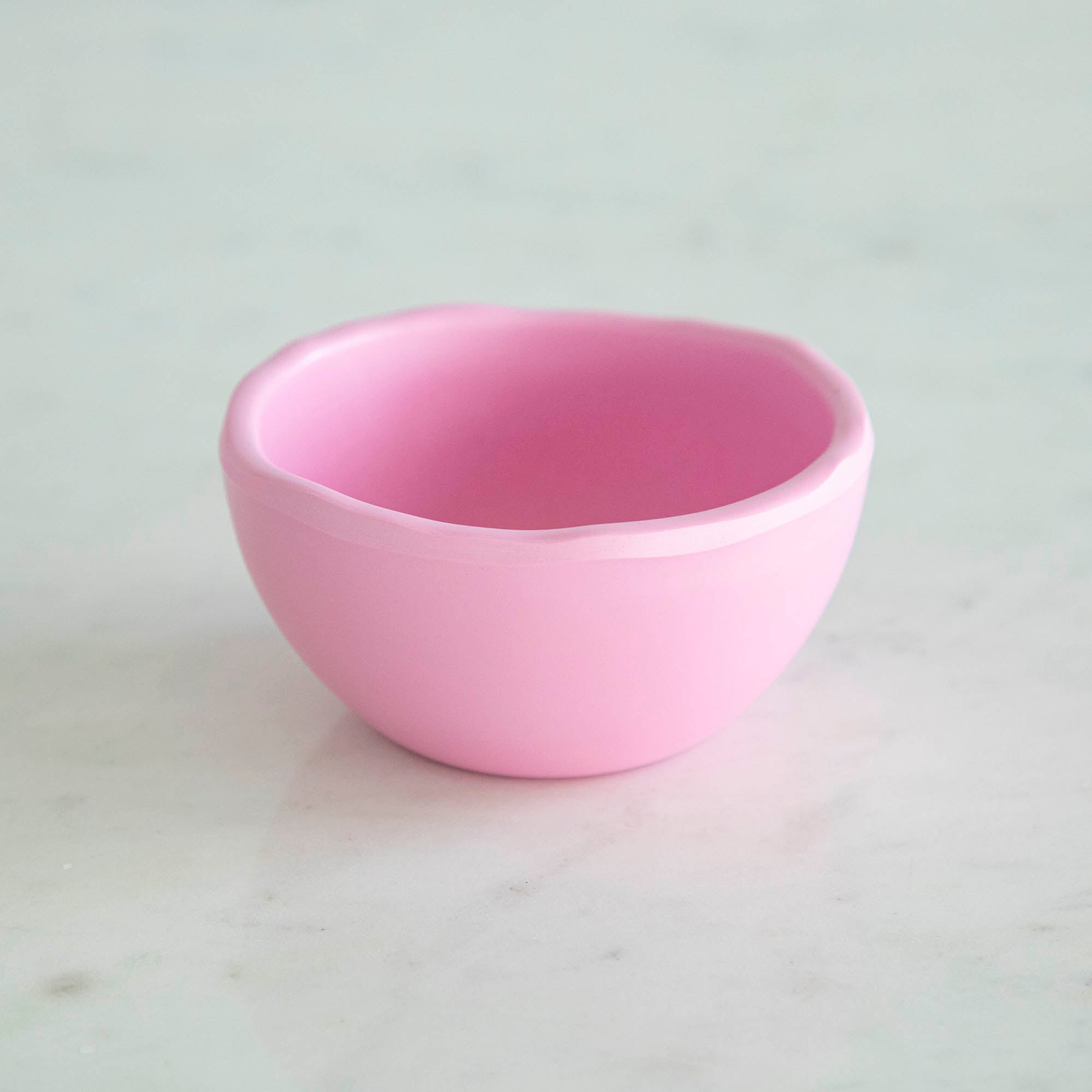 A set of colorful, dishwasher-safe Glitterville Rainbow Melamine Trinket Bowls on a table.